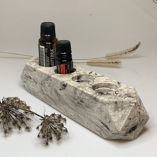 porta oli essenziali in cemento marmorizzato nero
